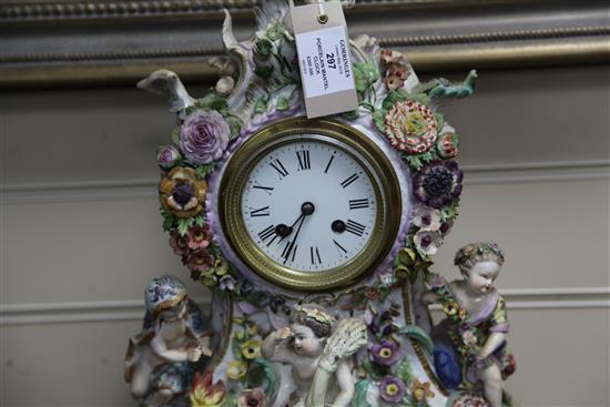 A late 19th century German porcelain mantel clock, 18in.